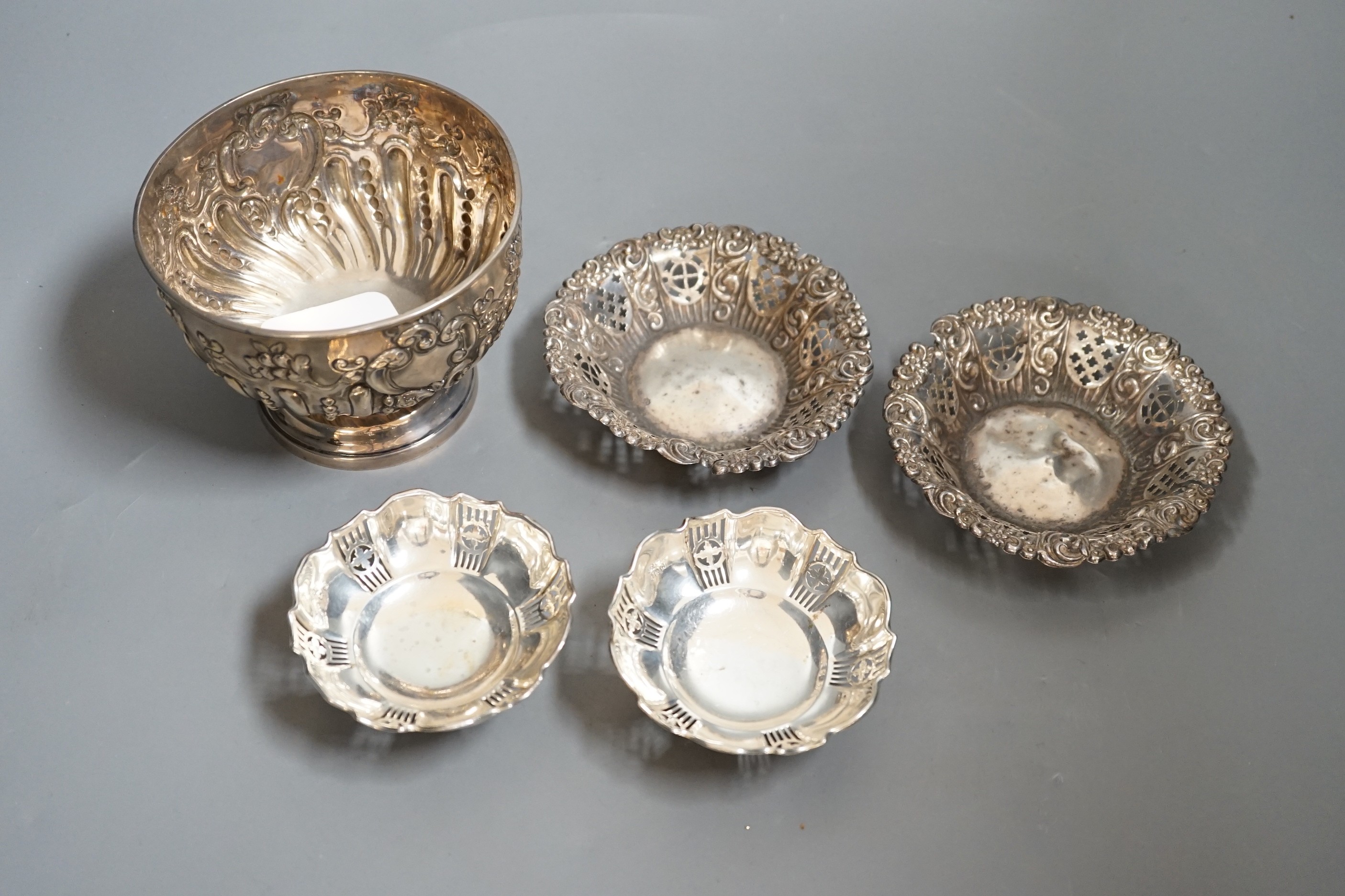 A late 19th/early 20th century repousse silver rose bowl, marks rubbed, diameter 12.6cm and two pairs of silver bonbon dishes.